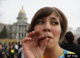 Jenny smokes a marijuana cigarette at a medical marijuana rally at Lincoln Park across from the Capitol in Denver, on Thursday, Jan. 14, 2010. (AP Photo/Ed Andrieski)