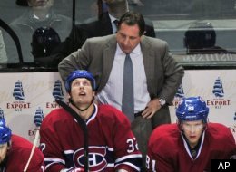 Montreal Canadiens coach Jacques Martin stands behind the bench as they face the Florida Panthers during third period NHL hockey action Monday, October 24, 2011, in Montreal. The Panthers beat the Canadiens 2-1. (AP Photo/Paul Chiasson, The Canadian Press)