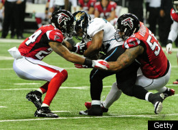 ATLANTA, GA - DECEMBER 15: Maurice Jones-Drew #32 of the Jacksonville Jaguars is tackled by Dominique Franks #24 and John Abraham #55 of the Atlanta Falcons at the Georgia Dome on December 15, 2011 in Atlanta, Georgia. (Photo by Scott Cunningham/Getty Images)