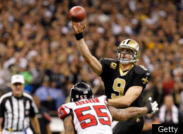 NEW ORLEANS, LA - DECEMBER 26: Quarterback Drew Brees #9 of the New Orleans Saints throws the ball as defensive end John Abraham #55 of the Atlanta Falcons rushes in during the second quarter at the Mercedes-Benz Superdome on December 26, 2011 in New Orleans, Louisiana. (Photo by Chris Graythen/Getty Images)