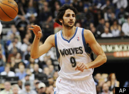 Minnesota Timberwolves' Ricky Rubio of Spain makes a pass as he makes his NBA debut against the Oklahoma City Thunder in the first half of an NBA basketball game Monday, Dec. 26, 2011, in Minneapolis. (AP Photo/Jim Mone)