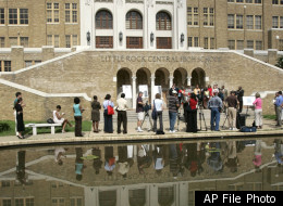 FILE - In this July 16, 2007, file photo, the image of Little Rock Central High School is reflected in a pond during a news conference in Little Rock, Ark. Nine black students desegregated the school in Sept., 1957. An appeals court said Wednsday, Dec. 28, 2011, that Arkansas cannot cut off millions of dollars in funding in Little Rock-area school districts until a challenge to the payments gets a separate federal hearing. (AP Photo/Danny Johnston, File)