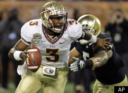 Florida State quarterback EJ Manuel (3) scrambles as he is pressured by Notre Dame linebacker Manti Te'o (5) during the first half of the Champs Sports Bowl NCAA college football game, Thursday, Dec. 29, 2011, in Orlando, Fla. (AP Photo/John Raoux)