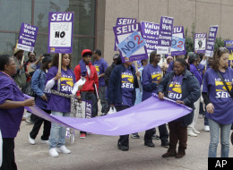 Members of the Service Workers International Union rally in downtown Cleveland Wednesday, Sept. 28, 2011. Rallies were held in 22 cities as contract expiration dates near for 60,000 SEIU represented janitors and office cleaners from Connecticut to Virginia. (AP Photo/Mark Duncan)