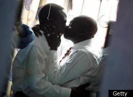 A Kenya-based gay couple kisses in 2006.