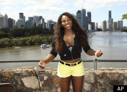 Serena Williams of the United States poses with the Brisbane city in the background for photo session at Brisbane International tennis tournament in Brisbane, Australia, Sunday, Jan 1, 2012. (AP Photo/Tertius Pickard)