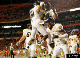MIAMI GARDENS, FL - JANUARY 04: Shawne Alston #20 and of the West Virginia Mountaineers celebrate after Alston scored 1-yard rushing touchdown in the second quarter against the Clemson Tigers during the Discover Orange Bowl at Sun Life Stadium on January 4, 2012 in Miami Gardens, Florida. (Photo by J. Meric/Getty Images)