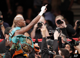 Floyd Mayweather celebrates his victory over Victor Ortiz shortly after their WBC welterweight title boxing match, Saturday, Sept. 17, 2011, at The MGM Grand Garden Arena in Las Vegas. (AP Photo/Eric Jamison)