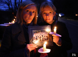 Charlotte Mayal (left) and Verity Worthiungton, former pupils of murder victim Betty Yates 77, hold a photo of their former teacher