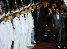 Iranian President Mahmoud Ahmadinejad (R) is welcomed with military honours at Maiquetia international airport in Caracas, on January 8, 2011 where he arrived to start a five-day tour aimed at shoring up ties in Latin America. (Getty)