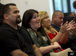 Melissa Pirraglio, second from left, applauds during the graduation ceremony of the Los Angeles Violence Intervention Training Academy (LAVITA) in Los Angeles, Tuesday, Dec. 20, 2011. Pirraglio spent many of her 11 years of gang life in drug-addled despair seeking a way out. “There's an inkling in every single gang member looking for an opportunity to come out,” said Pirraglio, now 34 and a counselor to troubled youth. (AP Photo/Jae C. Hong)