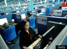 Workers at a Filipino call center handling calls from American customers.