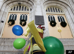 Yellow ribbons, signs and balloons, adorn the front of Saint Hubert's Catholic High School for girls after a protest Monday, Jan. 9, 2012, in Philadelphia. Students gathered to voice opposition for an archdiocese closure and consolidation plan that would shutter 48 schools including St. Hubert's. (AP Photo/Alex Brandon)