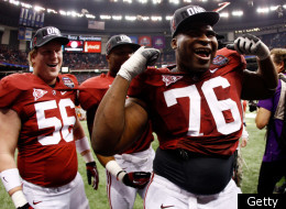 NEW ORLEANS, LA - JANUARY 09: D.J. Fluker #76 and William Ming #56 of the Alabama Crimson Tide celebrate after defeating Louisiana State University Tigers in the 2012 Allstate BCS National Championship Game at Mercedes-Benz Superdome on January 9, 2012 in New Orleans, Louisiana. Alabama won the game by a score of 21-0. (Photo by Chris Graythen/Getty Images)