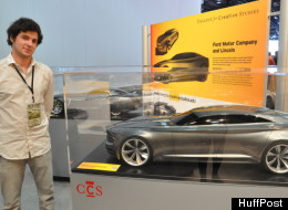 Brian Malczewski, a senior in the Automotive Design program at the College for Creative studies, stands with the D-class sedan model he made for for Lincoln.