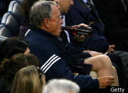 Mayor Bloomberg enjoys a brewsky at a ball game.