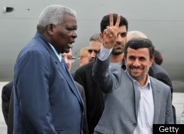 Iranian President Mahmoud Ahmadinejad (R) is welcomed by Cuban Vice-President Esteban Lazo upon his arrival at the Jose Marti international airport of Havana, on January 11, 2012. (Getty)