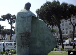 A giant bronze sculpture portraying Pope John Paul II is displayed outside Rome's Termini train Station, Friday, May 20, 2011. The Vatican is dismayed by a giant new sculpture portraying Pope John Paul II, saying the towering bronze work outside Rome's main train station doesn't even look like the late pontiff. Vatican newspaper L'Osservatore Romano says Friday the towering modernistic statue gives the impression a bomb hit the square. The artist, Oliviero Rainaldi, depicts the pontiff as if he