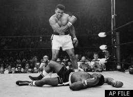 Heavyweight champion Muhammad Ali stands over fallen challenger Sonny Liston, shouting and gesturing shortly after dropping Liston with a short hard right to the jaw on May 25, 1965, in Lewiston, Maine.