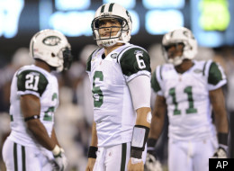 New York Jets quarterback Mark Sanchez (6) looks on with teammates LaDainian Tomlinson (21) and Jeremy Kerley (11) during the fourth quarter of an NFL football game, Sunday, Nov. 13, 2011, in East Rutherford, N.J. The Jets lost the game 37-16. (AP Photo/Bill Kostroun)