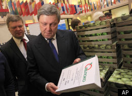Leader of the Yabloko party Grigory Yavlinsky shows lists with signatures in support of his candidacy as he submits documents to officially register as a candidate in March's presidential election, in the Central Election Commission in Moscow, Wednesday, Jan. 18, 2012. (AP Photo/Sergey Ponomarev)