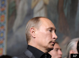 Russian Prime Minister Vladimir Putin, canter, attends a religion service as he visits the Spaso-Preobrazhensky Monastery on Valaam island, northern Russia, Sunday, Aug. 14, 2011. (AP)