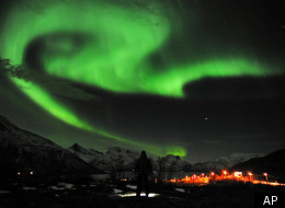 The aurora borealis, or Northern Lights, are seen near the city of Tromsoe, northern Norway, late Tuesday, Jan. 24, 2012. Stargazers were out in force in northern Europe on Tuesday, hoping to be awed by a spectacular showing of northern lights after the most powerful solar storm in six years. (AP Photo/Scanpix Norway, Rune Stoltz Bertinussen)