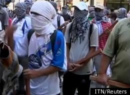 Protesters attacking a British bank in Buenos Aries