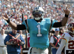Carolina Panthers' Cam Newton (1) reacts after barely missing a touchdown as Washington Redskins' DeAngelo Hall (23) looks on during the first quarter of an NFL football game in Charlotte, N.C., Sunday, Oct. 23, 2011. (AP Photo/Chuck Burton)