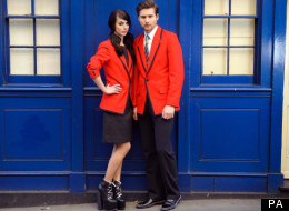 An unnamed male model and up and coming British designer Hannah Clayton, left, during the launch of the New Redcoat uniforms for Butlins