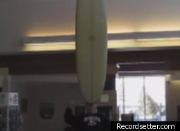 Canadian Doug McManaman recently set a world record by balancing a surfboard on his chin for 51.47 seconds.