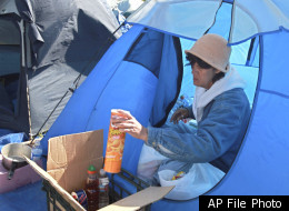 Germaine Brashear packs her possessions as she prepares to move from the homeless encampment where she had been living, in Sacramento, Calif., Wednesday, April 15, 2009. Dozens of people living in a tent city near downtown Sacramento did the same to comply with a police deadline. Homeless men and women have since returned to the area, and conditions have drawn the attention of a United Nation's Human Rights observer.