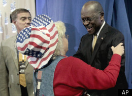 FILE: Former Republican presidential candidate Herman Cain greets Ann Sullivan of Goldsboro, N.C., before speaking to the Southern Republican Leadership Conference Thursday, Jan. 19, 2012, in Charleston, S.C.
