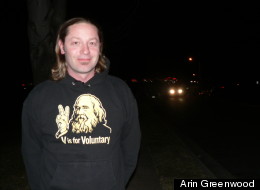 Eddie Free, wearing a V is for Voluntary shirt featuring the image of anarchist Lysander Spooner.