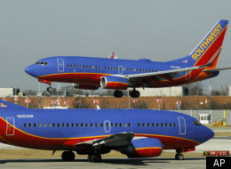 On Feb. 9, 2012, a Southwest Airlines Boeing 737 waits to take off at Chicago's Midway Airport as another lands. Southwest Airlines has been a huge beneficiary of the rise in the number of super-commuters in Texas. Southwest Airlines flies 25 flights per day between Houston and Dallas, according to Bloomberg News.