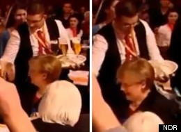 Something cold and wet: The German Chancellor is drenched