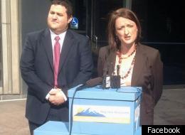 Mason Tvert and Betty Aldworth submitting the Campaign to Regulate Marijuana Like Alcohol's additional 14,000+ signatures with Gov. Gary Johnson.