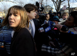 Former Illinois Gov. Rod Blagojevich, right, returns home with his wife Patti in Chicago, Wednesday, Dec. 7, 2011, after he was sentenced by Judge James Zagel to 14 years in prison for his convictions on 18 corruption counts, including trying to to auction off President Barack Obama's old Senate seat. (AP Photo/Charles Rex Arbogast)