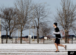 A runner jogs along Chicago's lakefront last month. Illinois's winter was its third warmest on record.