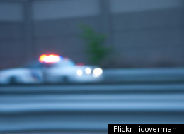 A police car flashes its lights. Detroit Police are looking prioritize calls with a new emergency reporting ranking system.