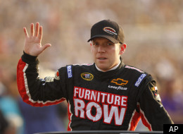 Regan Smith waves to the crowd prior to the start of the NASCAR Sprint Cup race at the Richmond International Raceway in Richmond, Va., Saturday, April 30, 2011. (AP Photo/Steve Helber)