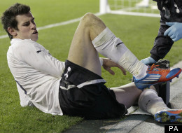Gareth Bale receives treatment after winning Tottenham a penalty against Stevenage