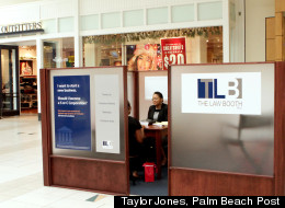 Attorney Melva Rozier meets with a client at the Law Booth, located inside the Boynton Beach Mall.