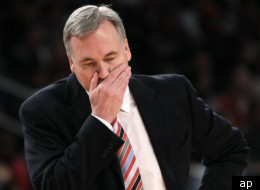 New York Knicks' head coach Mike D'Antoni walks onto the court during a time out during the first half of an NBA basketball game against the Philadelphia 76ers in New York, Sunday, March 11, 2012. The 76ers defeated the Knicks 106-94. (AP Photo/Seth Wenig)