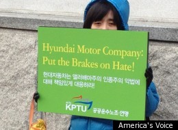 Protester stands outside Hyundai shareholder meeting in Seoul.