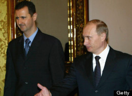 Russian President Vladimir Putin (R) receives Syrian President Bashar al-Assad (L) during their meeting in Moscow's Kremlin, January 25, 2005. Russia and Syria have reached a deal on restructuring debt owed by Syria left over from the Soviet era, the Syrian and Russian presidents announced after Kremlin talks. (Photo by Salah Malkawi/ Getty Images)