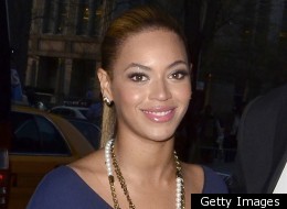 Beyonce wows in a tight blue Victoria Beckham dress.