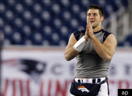 Denver Broncos quarterback Tim Tebow waits to warm up before an NFL divisional playoff football game between the Denver Broncos New England Patriots Saturday, Jan. 14, 2012, in Foxborough, Mass. (AP Photo/Elise Amendola)