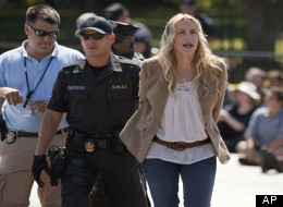 In this Aug. 30, 2011 file photo, actress Daryl Hannah is arrested by U.S. Park Police during a Keystone XL Pipeline protest in front of the White House in Washington. The high-profile anti-pipeline campaign included repeated arrests of activists outside the White House. (AP Photo/Evan Vucci, File)
