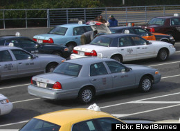 Cabs line up in the taxi queue at Reagan National Airport.